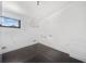 A simple room with a dark wood floor, white walls, and natural light at 2123 Drew Valley Ne Rd, Brookhaven, GA 30319