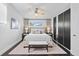 Comfortable bedroom with ceiling fan, dark wood floor, and built-in wardrobes at 2123 Drew Valley Ne Rd, Brookhaven, GA 30319