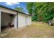 A detached garage with an open door, next to a spacious fenced in backyard with mature trees at 2123 Drew Valley Ne Rd, Brookhaven, GA 30319