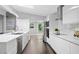 Bright kitchen with modern appliances, stone countertops, and ample cabinet space for storage solutions at 2123 Drew Valley Ne Rd, Brookhaven, GA 30319