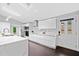 Modern kitchen featuring sleek white cabinetry, quartz countertops, and stainless steel appliances at 2123 Drew Valley Ne Rd, Brookhaven, GA 30319