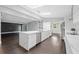 Open-concept kitchen with a large island, flowing seamlessly into the living area, great for entertaining at 2123 Drew Valley Ne Rd, Brookhaven, GA 30319