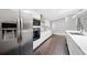A stylish kitchen featuring stainless steel appliances and sleek white cabinets, perfect for culinary enthusiasts at 2123 Drew Valley Ne Rd, Brookhaven, GA 30319