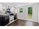 Well-equipped laundry room with modern washer and dryer, functional storage, and access to the backyard at 2123 Drew Valley Ne Rd, Brookhaven, GA 30319