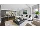 Bright living and dining area featuring modern furniture, dark floors, and stylish decor for comfortable living at 2123 Drew Valley Ne Rd, Brookhaven, GA 30319