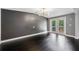 Bright living space with dark accent wall and a French door leading to the exterior at 2123 Drew Valley Ne Rd, Brookhaven, GA 30319