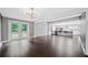 Open concept living area leading to a modern kitchen with French doors to the backyard at 2123 Drew Valley Ne Rd, Brookhaven, GA 30319