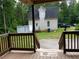 Spacious backyard view from the deck, offering a private retreat surrounded by lush trees and nature at 5365 Winding Ln, Suwanee, GA 30024