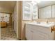 Cozy bathroom featuring a white vanity, cabinet, and patterned floors at 5365 Winding Ln, Suwanee, GA 30024