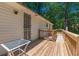 Wooden deck and patio area with railings offers great backyard outdoor living at 5365 Winding Ln, Suwanee, GA 30024