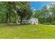 Charming two-story home nestled amongst mature trees with well-manicured lawn at 5365 Winding Ln, Suwanee, GA 30024