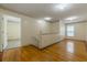 Bright hallway with hardwood floors and a view to the rooms in the house at 5365 Winding Ln, Suwanee, GA 30024