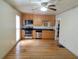 Modern kitchen with stainless steel appliances, light wood cabinets, and hardwood floors at 5365 Winding Ln, Suwanee, GA 30024