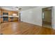 Open living room with hardwood floors and a view of the kitchen at 5365 Winding Ln, Suwanee, GA 30024