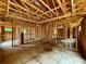Unfinished living room showing wood framework, and the layout of the home at 731 Crest Line Trl, Powder Springs, GA 30127