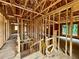 Unfinished interior showing a framed stairway and wood framework, capturing the construction phase of the home at 731 Crest Line Trl, Powder Springs, GA 30127