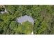 Aerial view of a home's roof surrounded by lush green trees at 2058 Sewanee Ct, Villa Rica, GA 30180