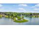 Stunning aerial view of a waterfront community on a lush peninsula surrounded by lake waters and mature trees at 2058 Sewanee Ct, Villa Rica, GA 30180