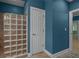 A well-lit bathroom showcasing a glass block shower, door, and blue wall at 2058 Sewanee Ct, Villa Rica, GA 30180