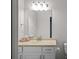 Bathroom featuring a vanity, large mirror, toilet and neutral walls at 2058 Sewanee Ct, Villa Rica, GA 30180