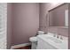 Powder room with a modern vanity, mirror, and fixtures at 2058 Sewanee Ct, Villa Rica, GA 30180