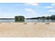 Expansive sandy beach area with lifeguard stands and picnic tables offering a relaxing lakeside experience at 2058 Sewanee Ct, Villa Rica, GA 30180
