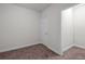 Neutral carpeted bedroom offers comfortable living space, ready for personalization at 2058 Sewanee Ct, Villa Rica, GA 30180