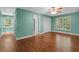 Bright bedroom with a ceiling fan, hardwood floors, and natural light at 2058 Sewanee Ct, Villa Rica, GA 30180
