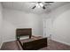 Bedroom with ceiling fan, carpet, and a door to another room at 2058 Sewanee Ct, Villa Rica, GA 30180
