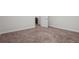 Spacious bedroom showcases neutral carpet and trim, with an open doorway at 2058 Sewanee Ct, Villa Rica, GA 30180