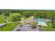 Aerial shot of community clubhouse with swimming pool, tennis courts, golf course, and parking lot at 2058 Sewanee Ct, Villa Rica, GA 30180
