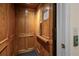 Interior wood-paneled elevator for easy access to all levels of this house at 2058 Sewanee Ct, Villa Rica, GA 30180