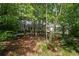 View of the front of a home surrounded by trees at 2058 Sewanee Ct, Villa Rica, GA 30180
