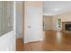 Open foyer with hardwood floors, fireplace, and leaded glass window in front door at 2058 Sewanee Ct, Villa Rica, GA 30180