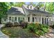 Beautiful single Gathering home with a covered porch and manicured front yard at 2058 Sewanee Ct, Villa Rica, GA 30180