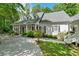 Exterior view of the home featuring manicured lawn and an inviting front porch at 2058 Sewanee Ct, Villa Rica, GA 30180