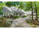 Charming home featuring a well-manicured lawn and a covered front porch at 2058 Sewanee Ct, Villa Rica, GA 30180