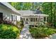 Charming home with inviting front porch, landscaped yard, and mature trees at 2058 Sewanee Ct, Villa Rica, GA 30180