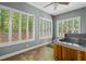 An indoor hot tub is surrounded by lots of natural light from multiple windows at 2058 Sewanee Ct, Villa Rica, GA 30180