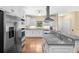 Modern kitchen with stainless steel appliances, granite countertops, and custom cabinetry at 2058 Sewanee Ct, Villa Rica, GA 30180