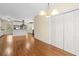 Open-concept kitchen and dining area featuring hardwood floors and white appliances and cabinets at 2058 Sewanee Ct, Villa Rica, GA 30180