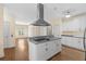 Well-equipped kitchen with a center island, sleek appliances, and hardwood flooring at 2058 Sewanee Ct, Villa Rica, GA 30180