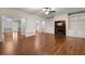 Hardwood floors, natural light, and a fireplace accent this living room's warm atmosphere at 2058 Sewanee Ct, Villa Rica, GA 30180