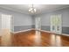 Open living room with hardwood floors and natural light with entry to back yard at 2058 Sewanee Ct, Villa Rica, GA 30180