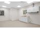 Bright utility room features a convenient sink, cabinets, and bright lighting at 2058 Sewanee Ct, Villa Rica, GA 30180