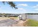Scenic waterfront view with an Adirondack chair overlooking docks and boats, highlighting a relaxing atmosphere at 2058 Sewanee Ct, Villa Rica, GA 30180