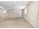 Spacious basement with paneled walls, carpeting, and natural light from the windows at 2135 Knighton Dr, Atlanta, GA 30349