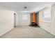 Retro finished basement featuring unique fireplace, painted paneling and neutral carpet at 2135 Knighton Dr, Atlanta, GA 30349