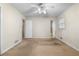 Spacious bedroom with carpet flooring, ceiling fan, and windows for natural light at 2135 Knighton Dr, Atlanta, GA 30349