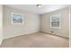 Neutral bedroom with carpet and two windows offering natural light at 2135 Knighton Dr, Atlanta, GA 30349